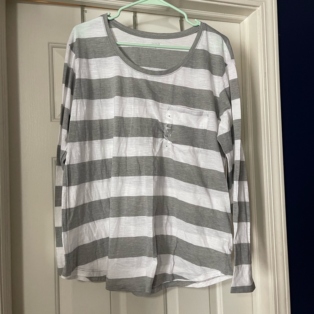 Gray and white striped t shirt.